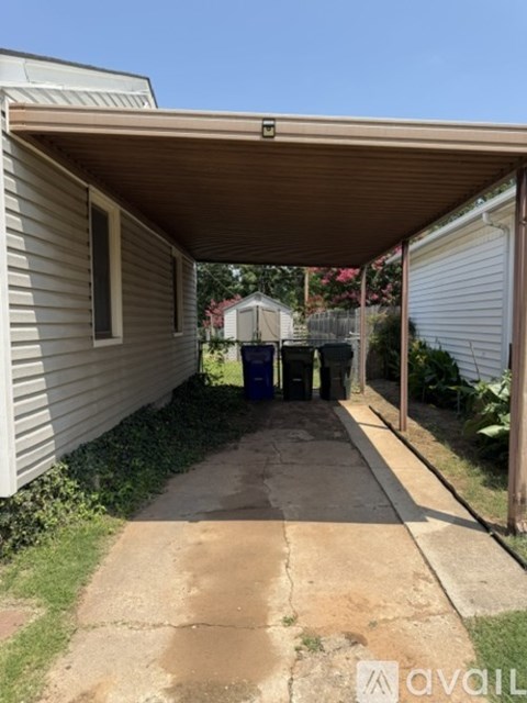 A covered walkway leads to a garage.