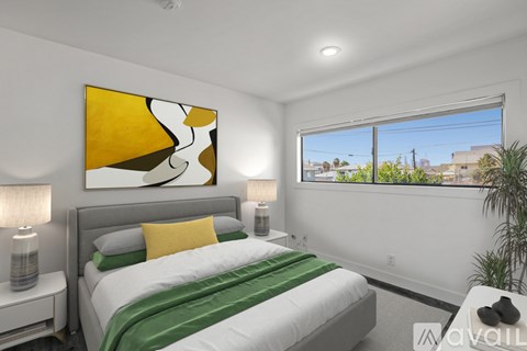 A bedroom with a large bed and a painting on the wall.