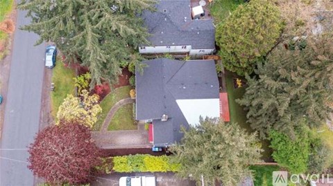 A house with a red sign in front of it.