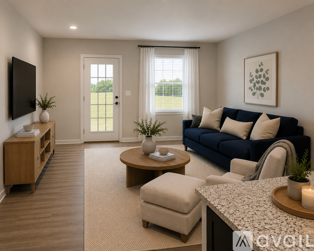 A living room with a blue couch, a wooden coffee table, and a flat-screen TV mounted on the wall.