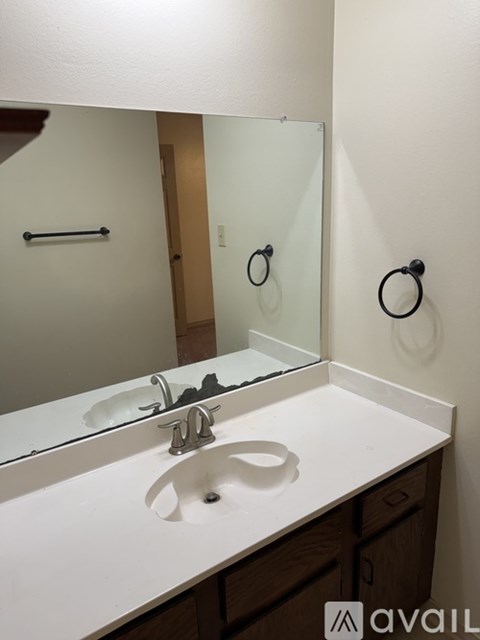 A bathroom sink with a mirror above it.
