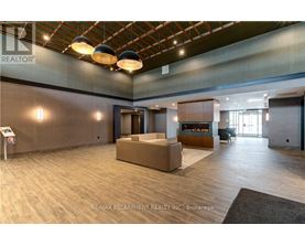 A spacious office lobby with a reception desk and a seating area.