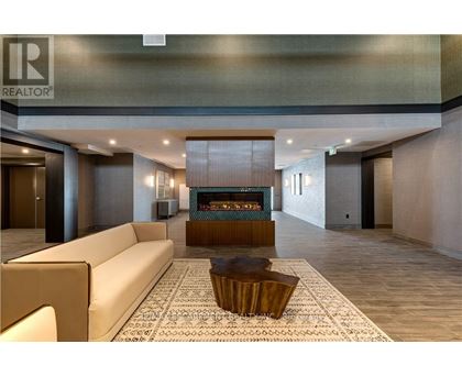A living room with a fireplace and a couch.