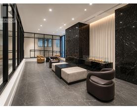 A modern living room with a marble floor and a fireplace.