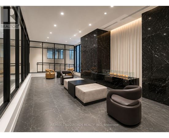 A modern living room with a marble floor and a fireplace.
