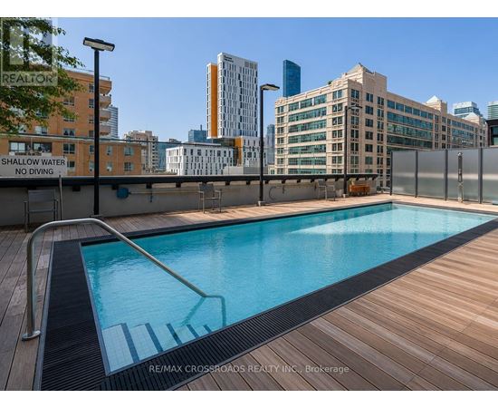 A pool with a sign that says Shallow Water No Diving.