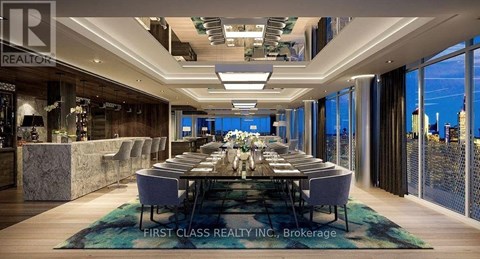 A dining room with a long table set for a meal.