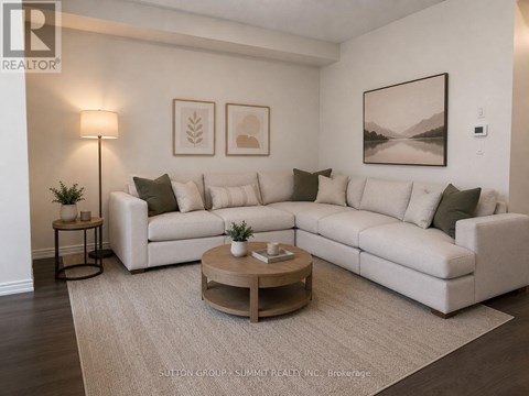 A living room with a white couch and a coffee table.