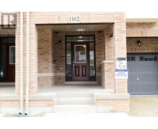 The front of a building with a sign that says "1162" on it.