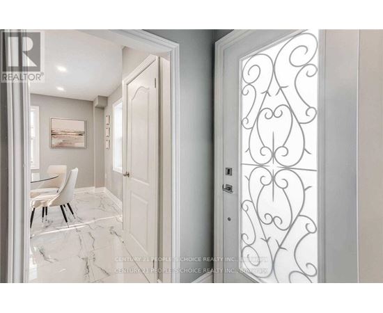 A white door with a decorative design on the right side.