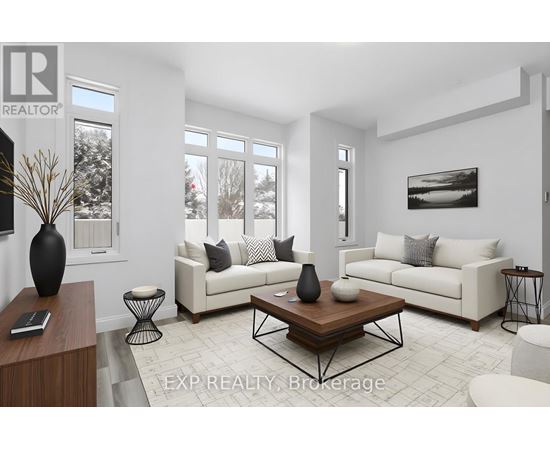 A living room with a white couch, a coffee table, and a large window.