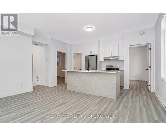 A realtor brokerage office with a white reception desk and a television on the wall.