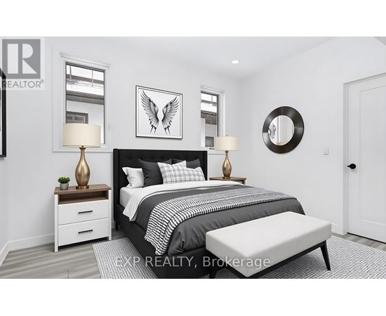 A bedroom with a large bed, a bench, and a mirror on the wall.