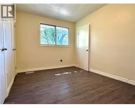 A room with a window and a door.