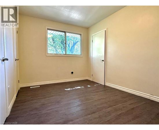 A room with a window and a door.
