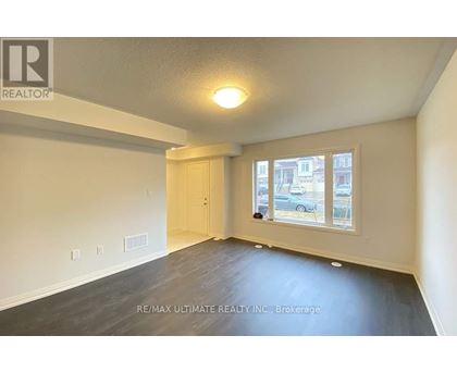A room with a window and a door is for rent.