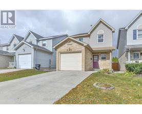 A house with a garage in front of it.
