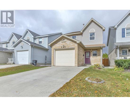 A house with a garage in front of it.