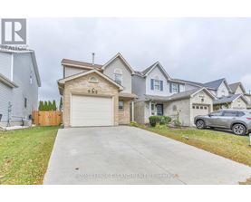 A house with a garage and a car parked in front.