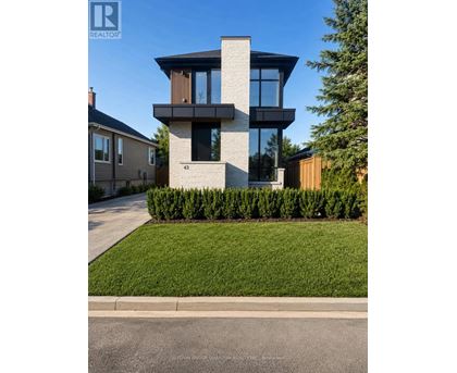 A modern house with a glass window is numbered 43.