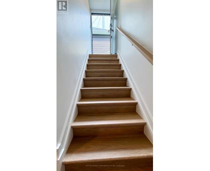 A set of stairs leading to a door.