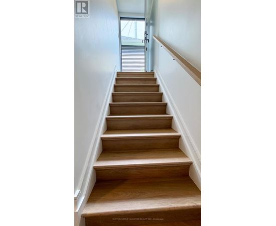 A set of stairs leading to a door.