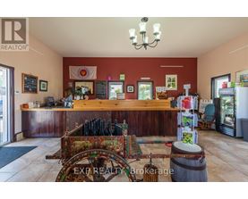 A realtor's office with a wooden counter and a chandelier.