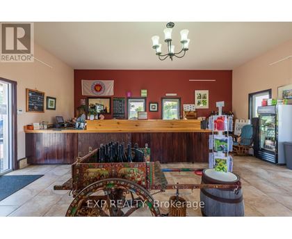 A realtor's office with a wooden counter and a chandelier.