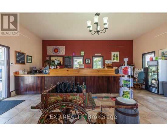 A realtor's office with a wooden counter and a chandelier.