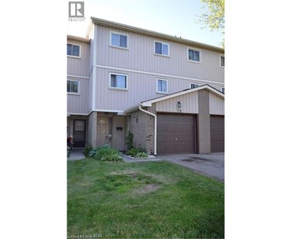 A two-story residential building with a garage.
