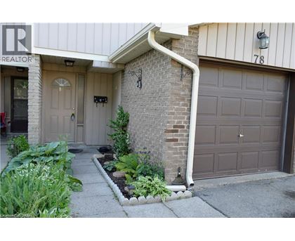 A house with a brown garage door and a white door.