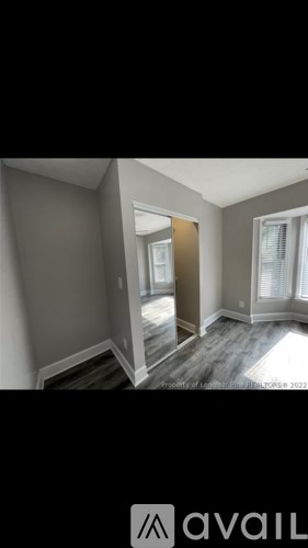 A room with a doorway leading to another room.