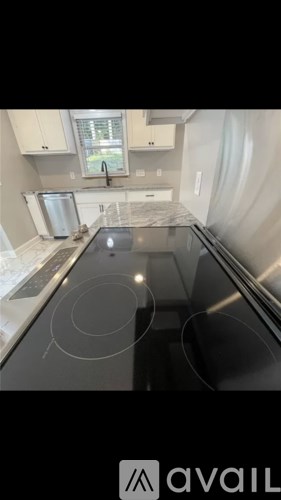 A kitchen with a stove top oven and a microwave.