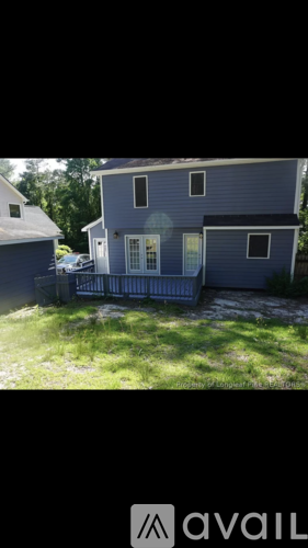 A house with a blue exterior is for sale.