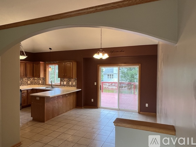 A kitchen with a sink and a counter.
