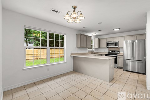 A kitchen with a large island in the middle.
