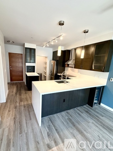A modern kitchen with a large island in the middle.