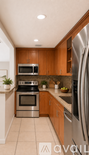 A kitchen with wooden cabinets and stainless steel appliances.