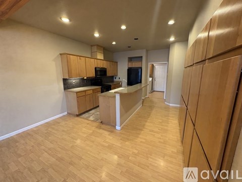 A kitchen with wooden cabinets and a countertop.