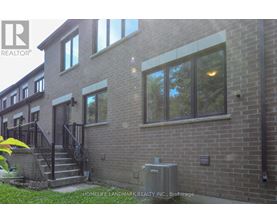 A brick building with a sign that says HomeLife Landmark Realty Inc. Brokerage.
