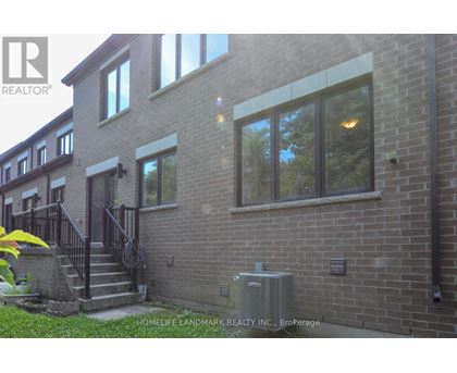 A brick building with a sign that says HomeLife Landmark Realty Inc. Brokerage.