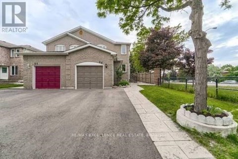 A house with a red garage door is for sale.