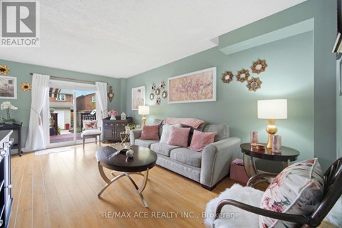 A living room with a grey couch and a coffee table.