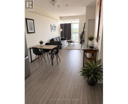 A living room with a dining table and chairs.