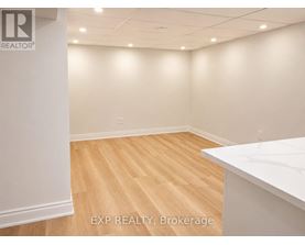A room with EXP REALTY, Brokerage logo on the wall.