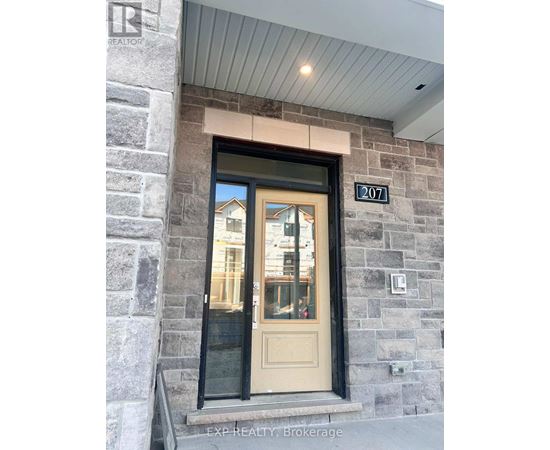 The door is numbered 207 and is part of a stone building.