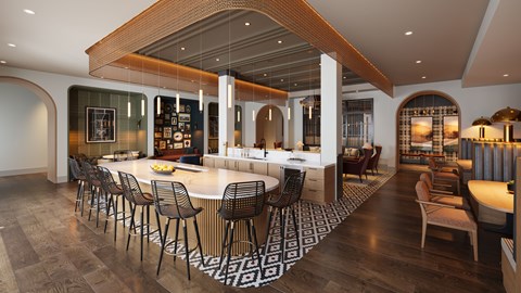 A modern dining room with a long table and chairs.