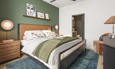 A bedroom with a bed, nightstand, and lamp.