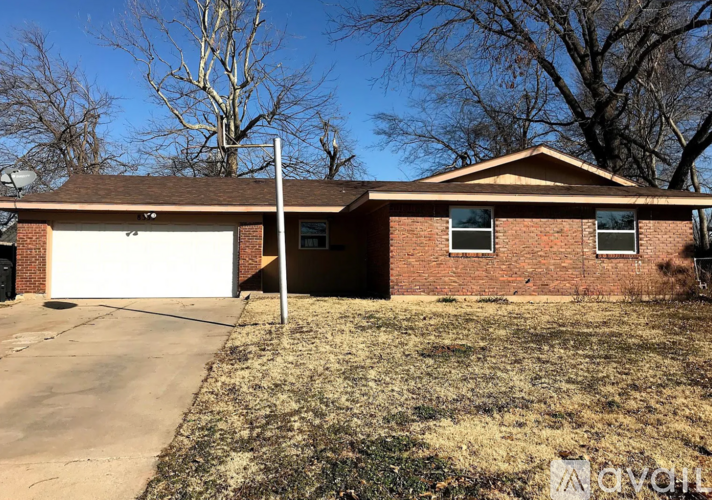 A house with a garage and a driveway.