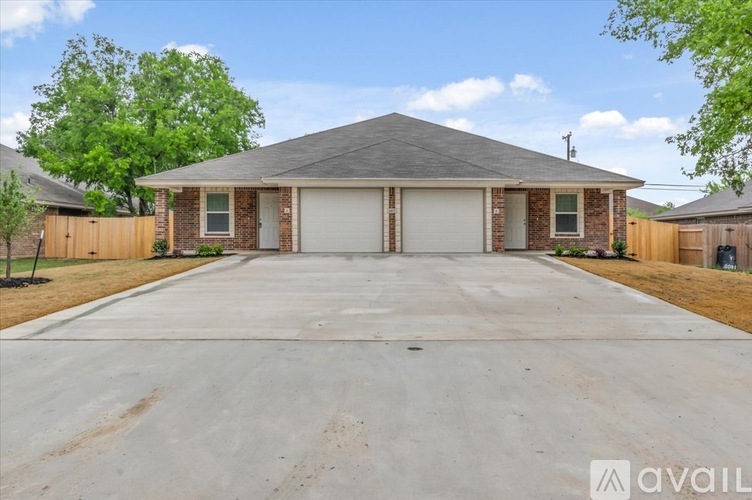 A house with a garage is available for sale.